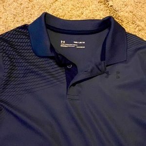 Grayish navy blue polo with black design on shoulders. Loose fit, heatgear.
